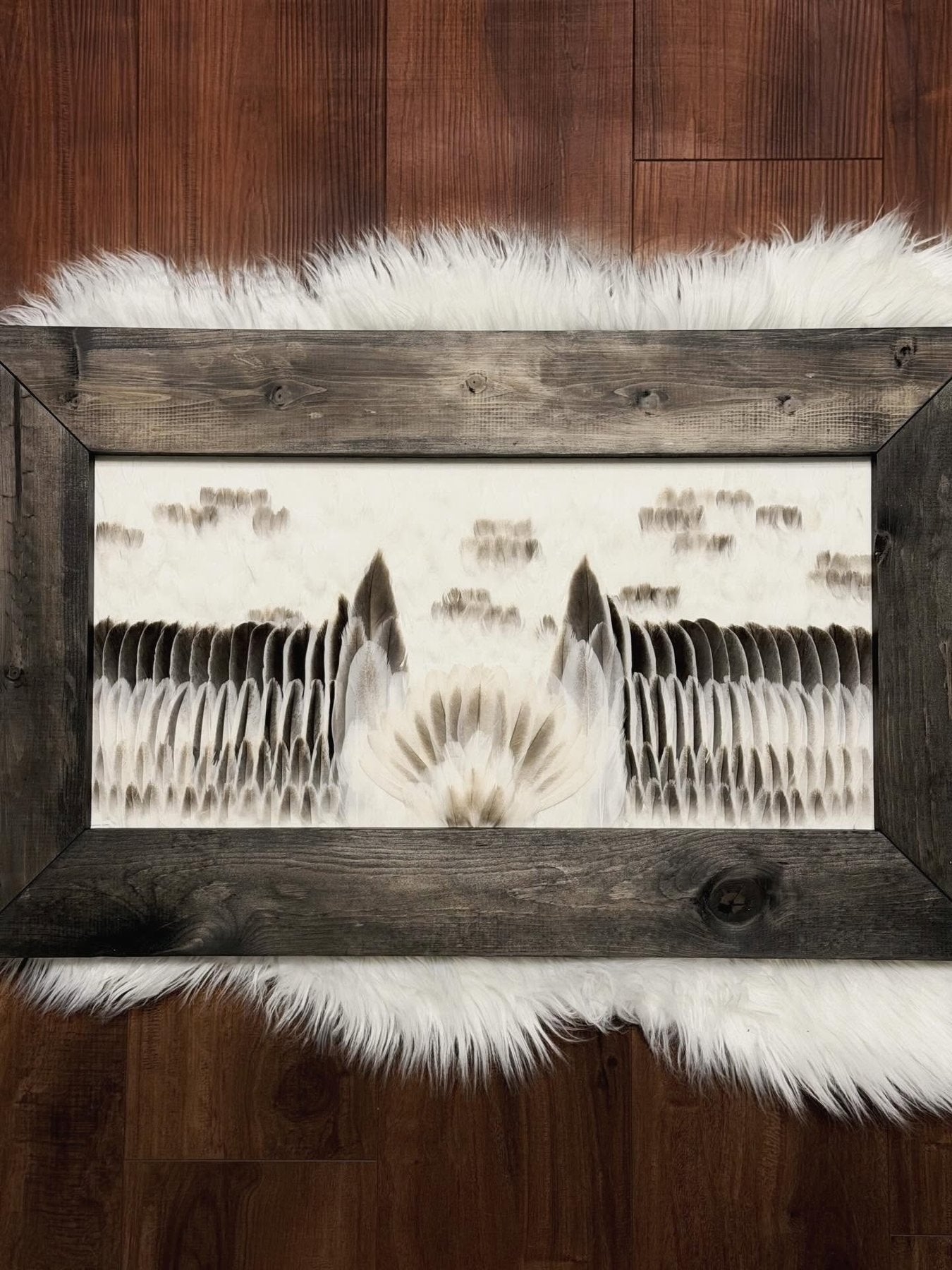 White waterfowl feather artwork